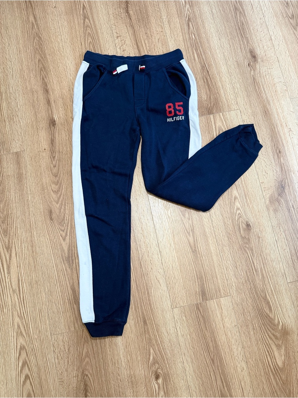 Tommy Hilfiger Navy Joggers with White Side Stripes and Red Logo